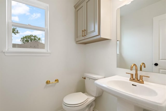 bathroom with toilet and sink