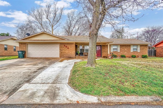 ranch-style home with a front lawn and a garage