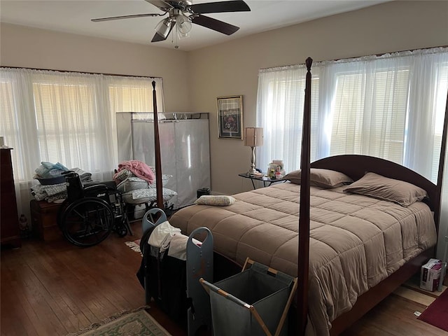 bedroom with hardwood / wood-style flooring and ceiling fan