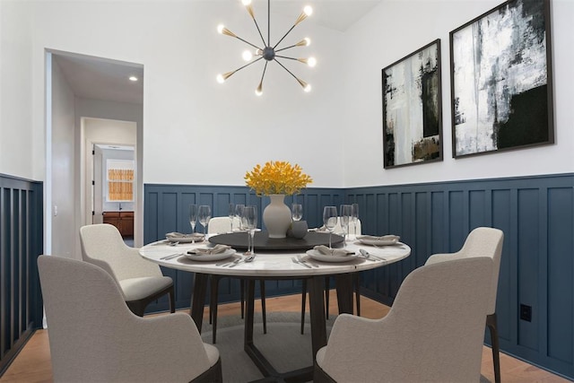 dining room featuring a chandelier and wood-type flooring