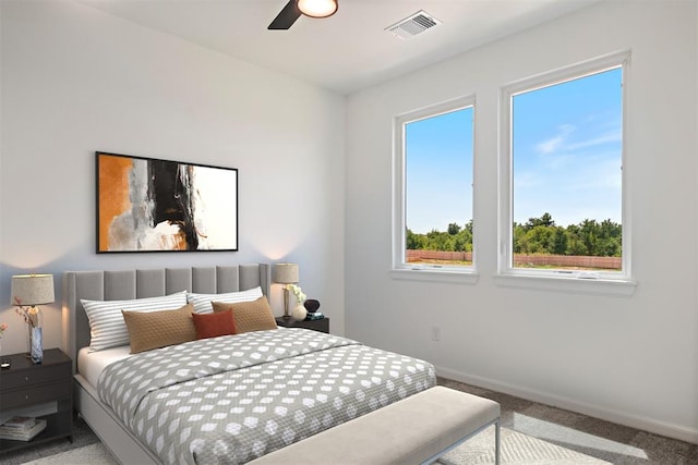 carpeted bedroom with ceiling fan