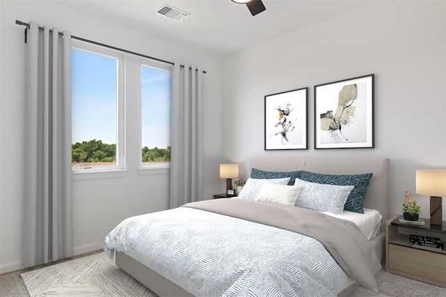 bedroom featuring ceiling fan and light carpet