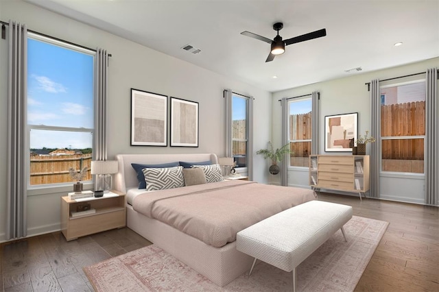 bedroom featuring hardwood / wood-style floors and ceiling fan