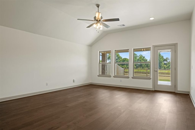 empty room featuring dark hardwood / wood-style floors, ceiling fan, and lofted ceiling