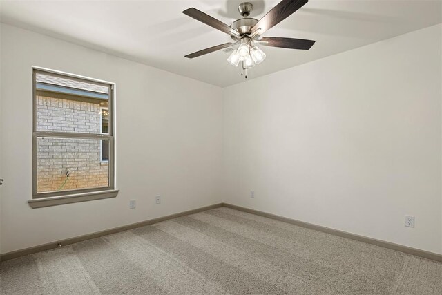 unfurnished room featuring carpet and ceiling fan