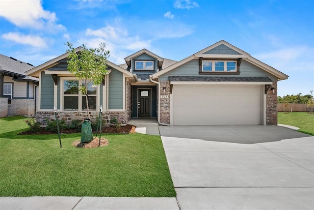 craftsman inspired home with a garage and a front lawn