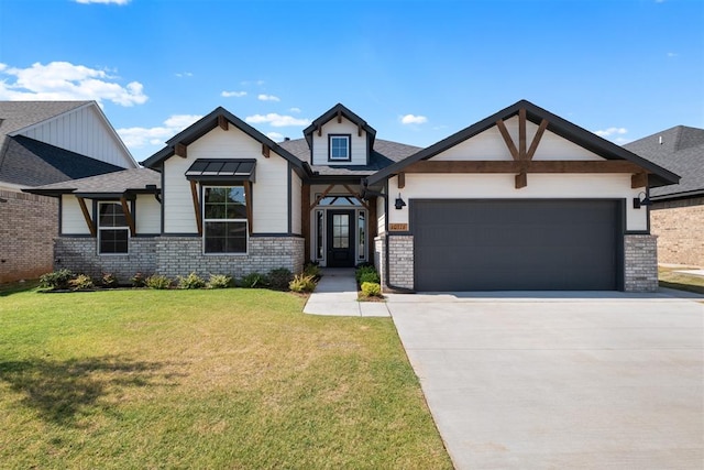 view of front of property with a front lawn and a garage