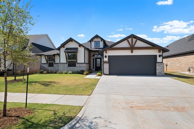 view of front of home with a front yard and a garage