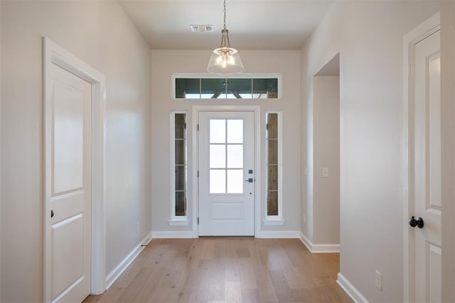 foyer entrance with light wood-type flooring