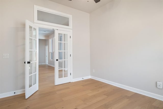 unfurnished room featuring ceiling fan, light hardwood / wood-style floors, and french doors