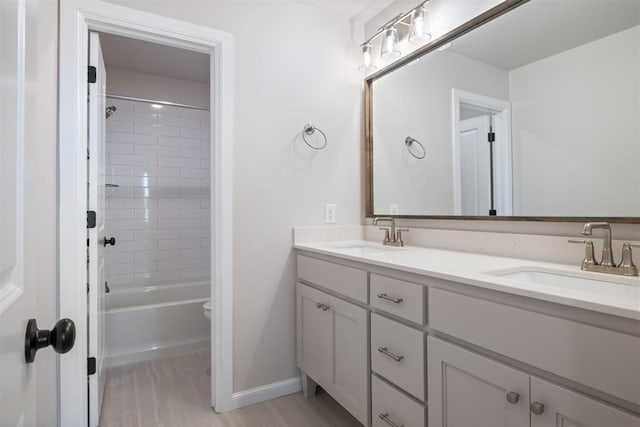 bathroom featuring vanity and tiled shower / bath combo