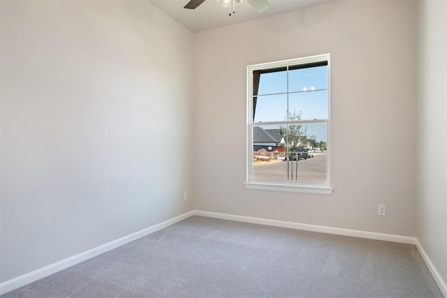 unfurnished room featuring carpet floors and ceiling fan