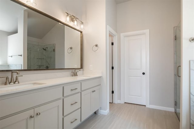 bathroom with vanity and walk in shower