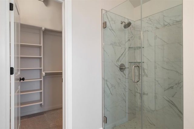 bathroom with a shower with shower door