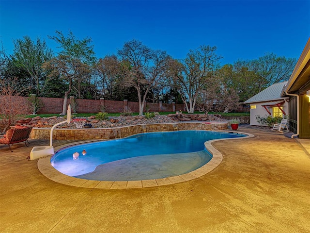 view of swimming pool with a patio