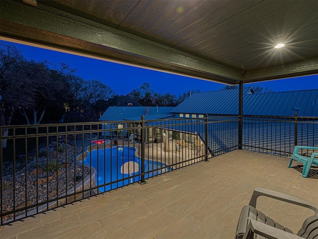 view of patio with a fenced in pool