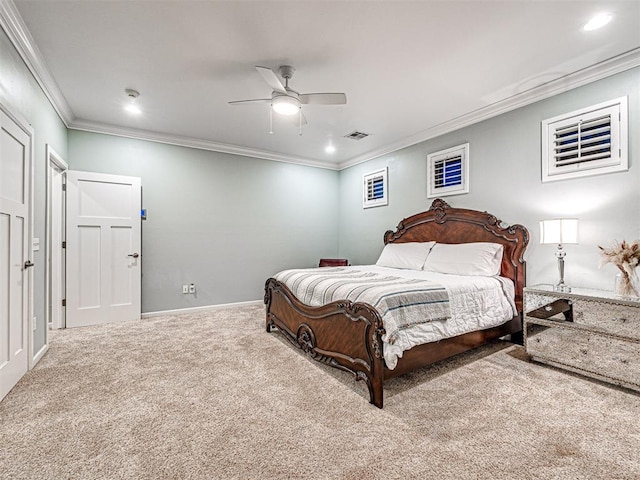 carpeted bedroom featuring ceiling fan and ornamental molding