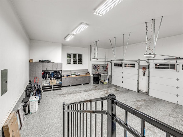 garage featuring a workshop area and a garage door opener