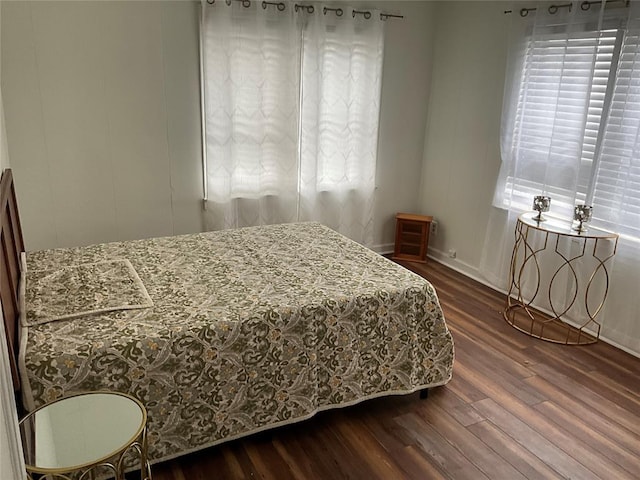 bedroom with hardwood / wood-style flooring