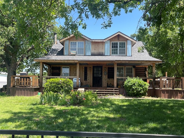 view of front of home featuring covered porch and a front yard