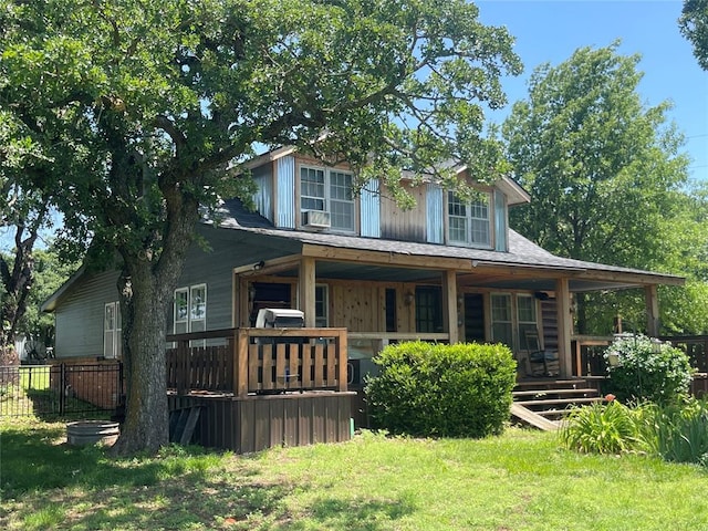 view of front facade with a front lawn and a porch