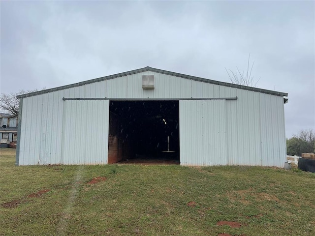 view of outdoor structure with a yard