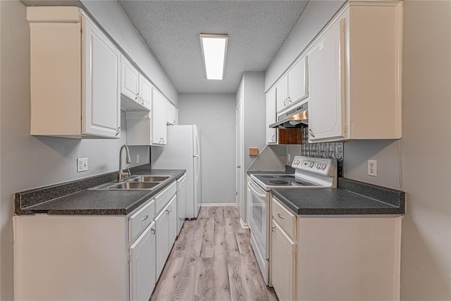 kitchen with white appliances, sink, light wood-type flooring, a textured ceiling, and white cabinetry