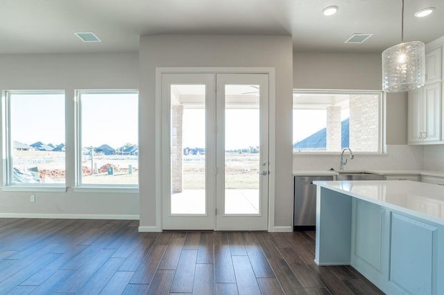 doorway with sink and dark hardwood / wood-style floors