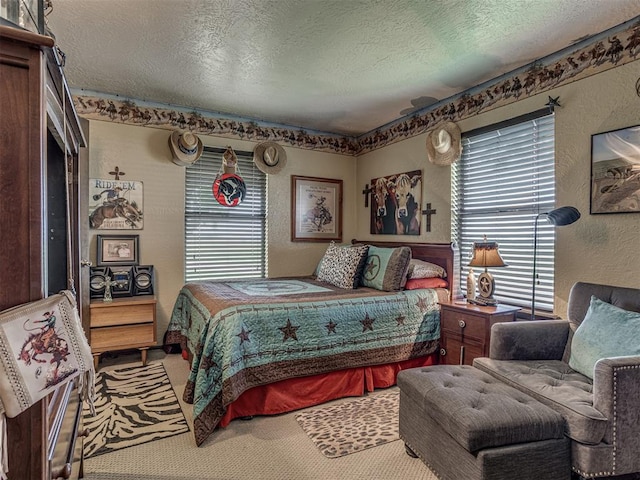 carpeted bedroom featuring a textured ceiling