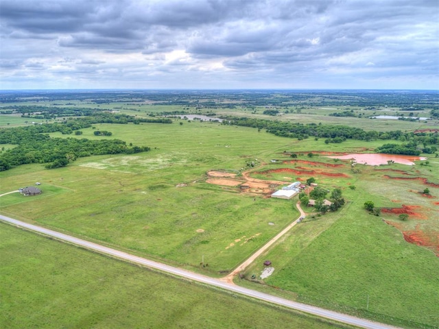 birds eye view of property featuring a rural view