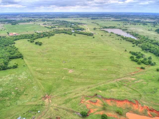 aerial view with a rural view and a water view