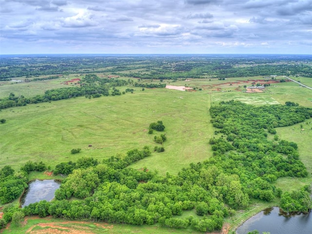 aerial view with a rural view and a water view