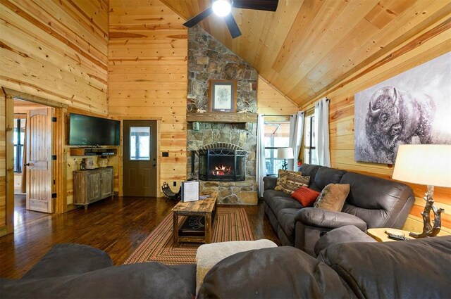 living room with ceiling fan, wooden ceiling, dark hardwood / wood-style flooring, high vaulted ceiling, and wooden walls