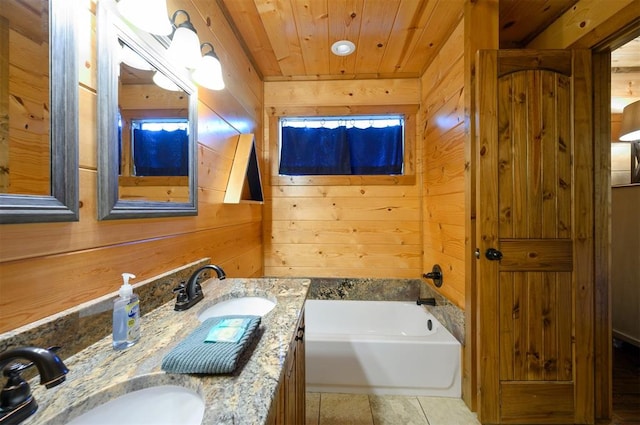 bathroom featuring a tub, wooden ceiling, tile patterned floors, wooden walls, and vanity