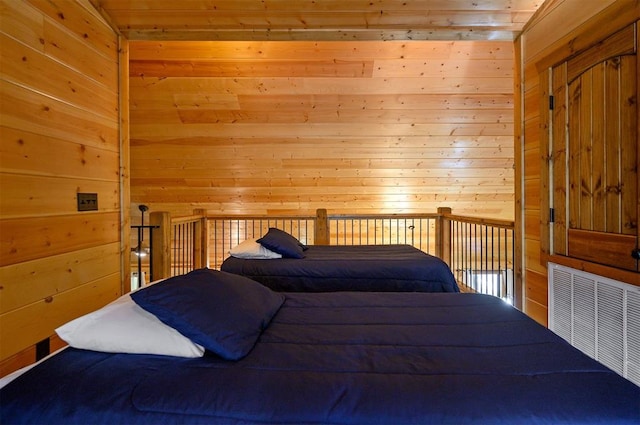 bedroom featuring wood walls and wooden ceiling