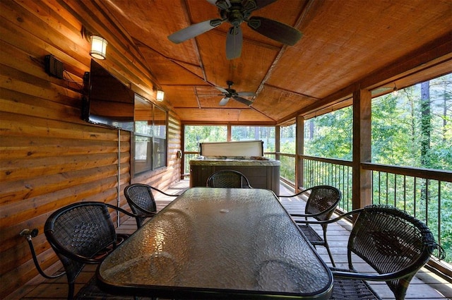 sunroom featuring plenty of natural light, wooden ceiling, and ceiling fan