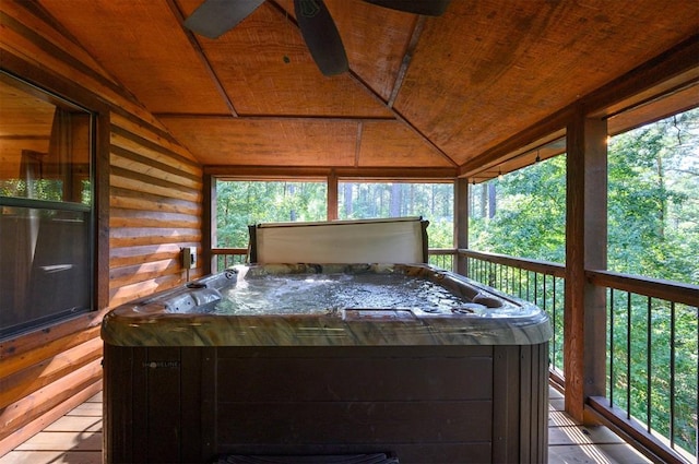 wooden deck featuring a hot tub and ceiling fan