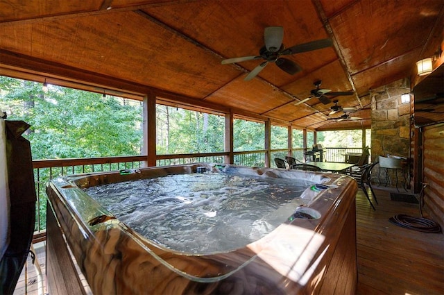 sunroom / solarium featuring a jacuzzi, plenty of natural light, wood ceiling, and vaulted ceiling