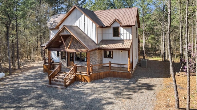 view of front of home featuring a porch and central air condition unit