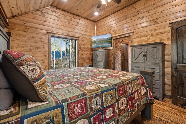 bedroom featuring hardwood / wood-style flooring, ceiling fan, lofted ceiling, and wood ceiling