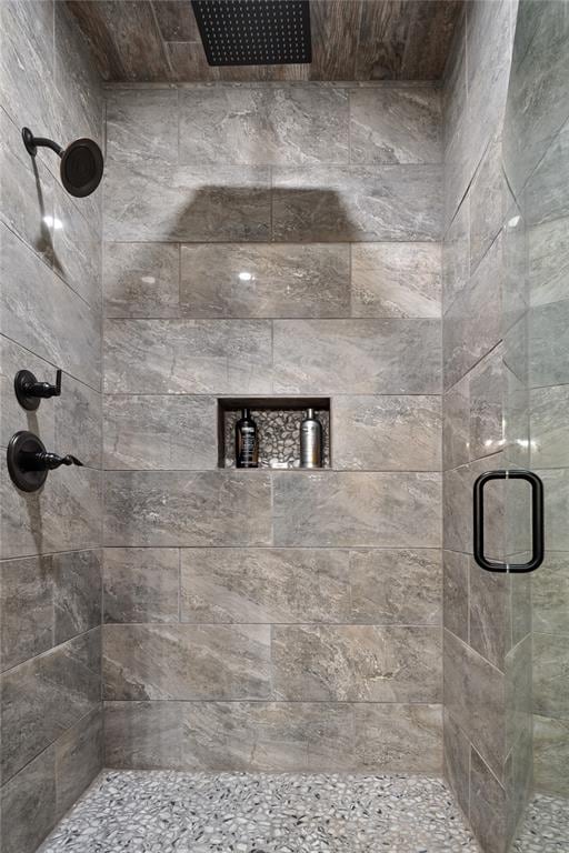 bathroom with a shower with shower door