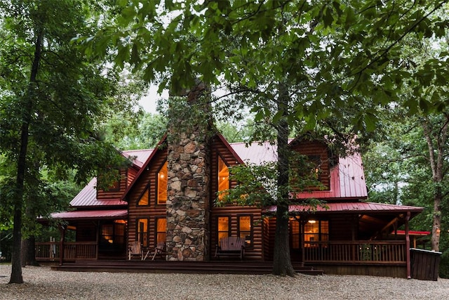 back of house featuring a porch