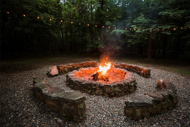 view of yard with an outdoor fire pit