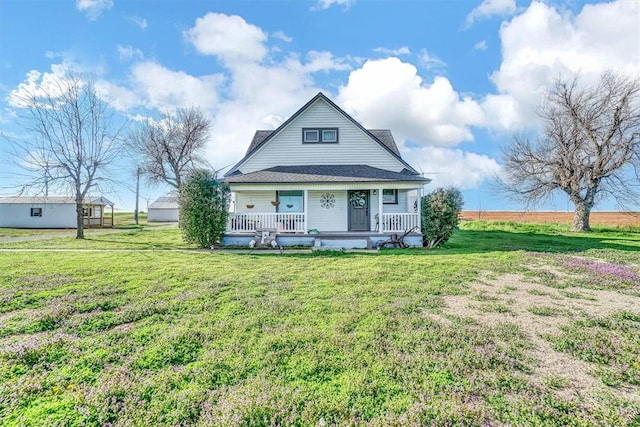 view of front of house with a porch and a front lawn