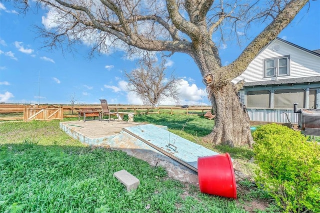 view of storm shelter featuring a lawn and a rural view