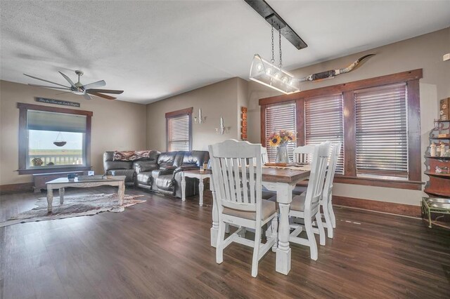 dining area featuring ceiling fan, dark hardwood / wood-style flooring, and a textured ceiling