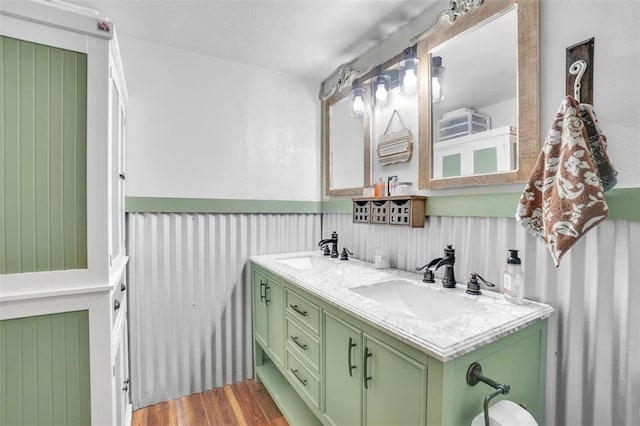 bathroom with vanity and wood-type flooring