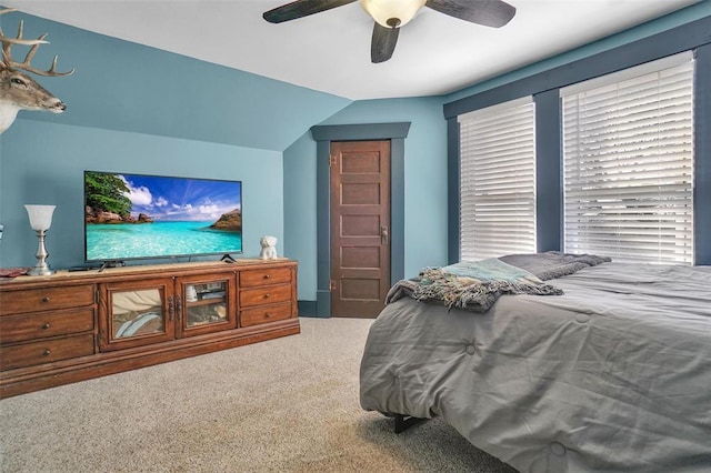 bedroom featuring carpet, ceiling fan, and lofted ceiling