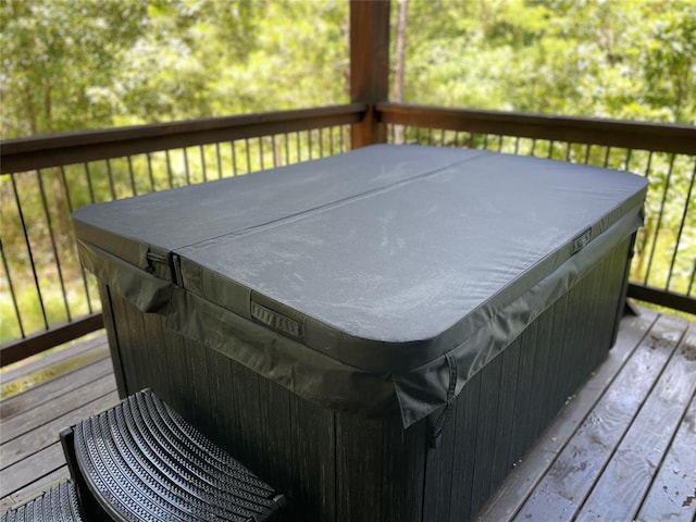 wooden terrace with a hot tub