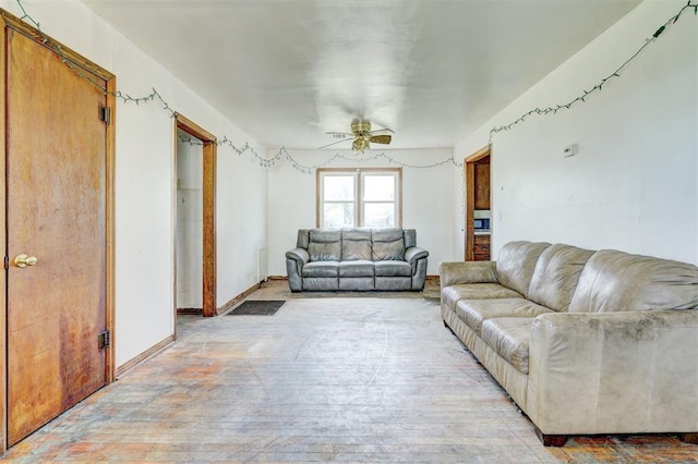 living room featuring ceiling fan and light wood-type flooring